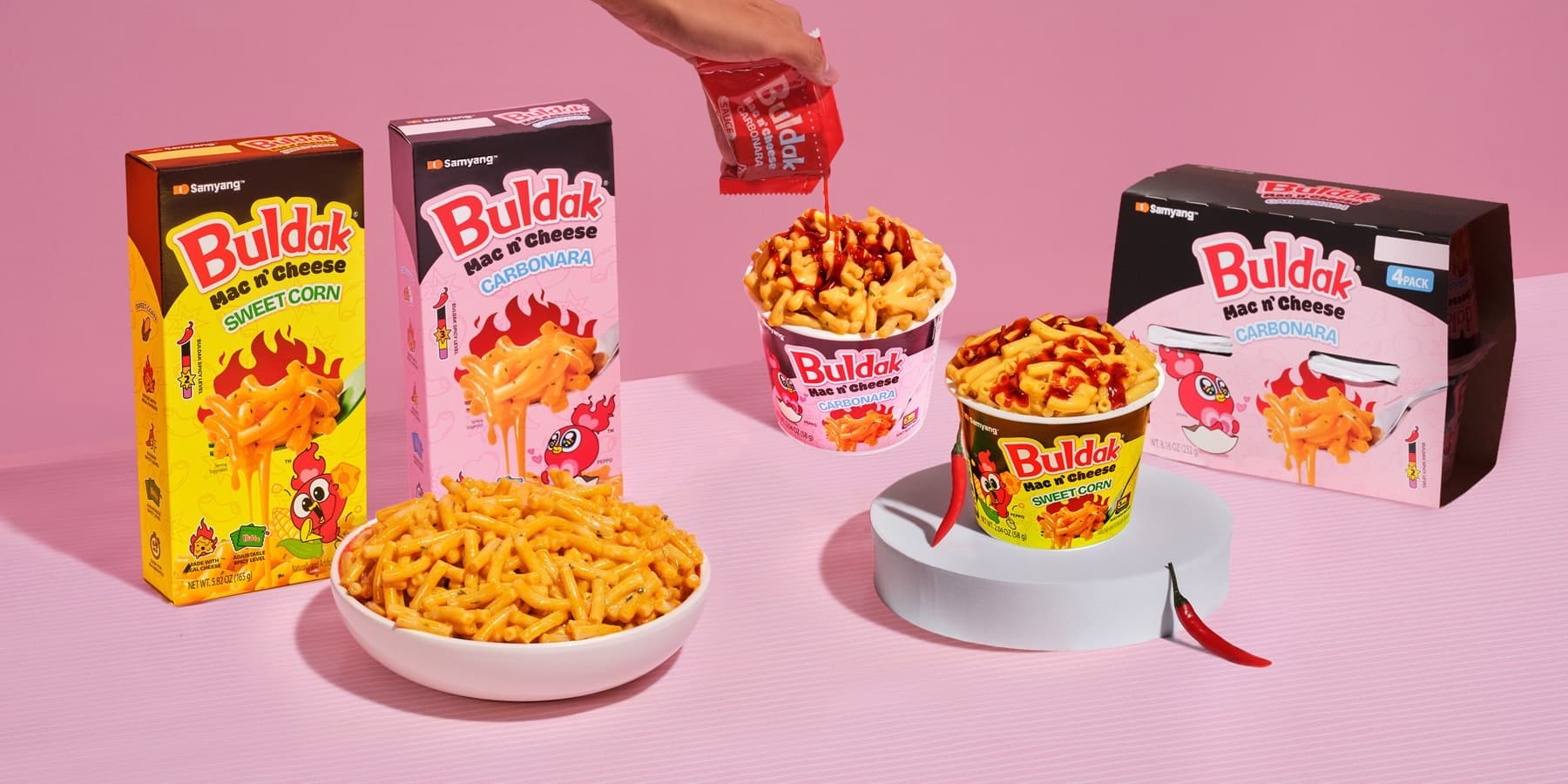 Samyang Buldak Mac and Cheese Sweet Corn and Carbonara boxes with prepared bowls