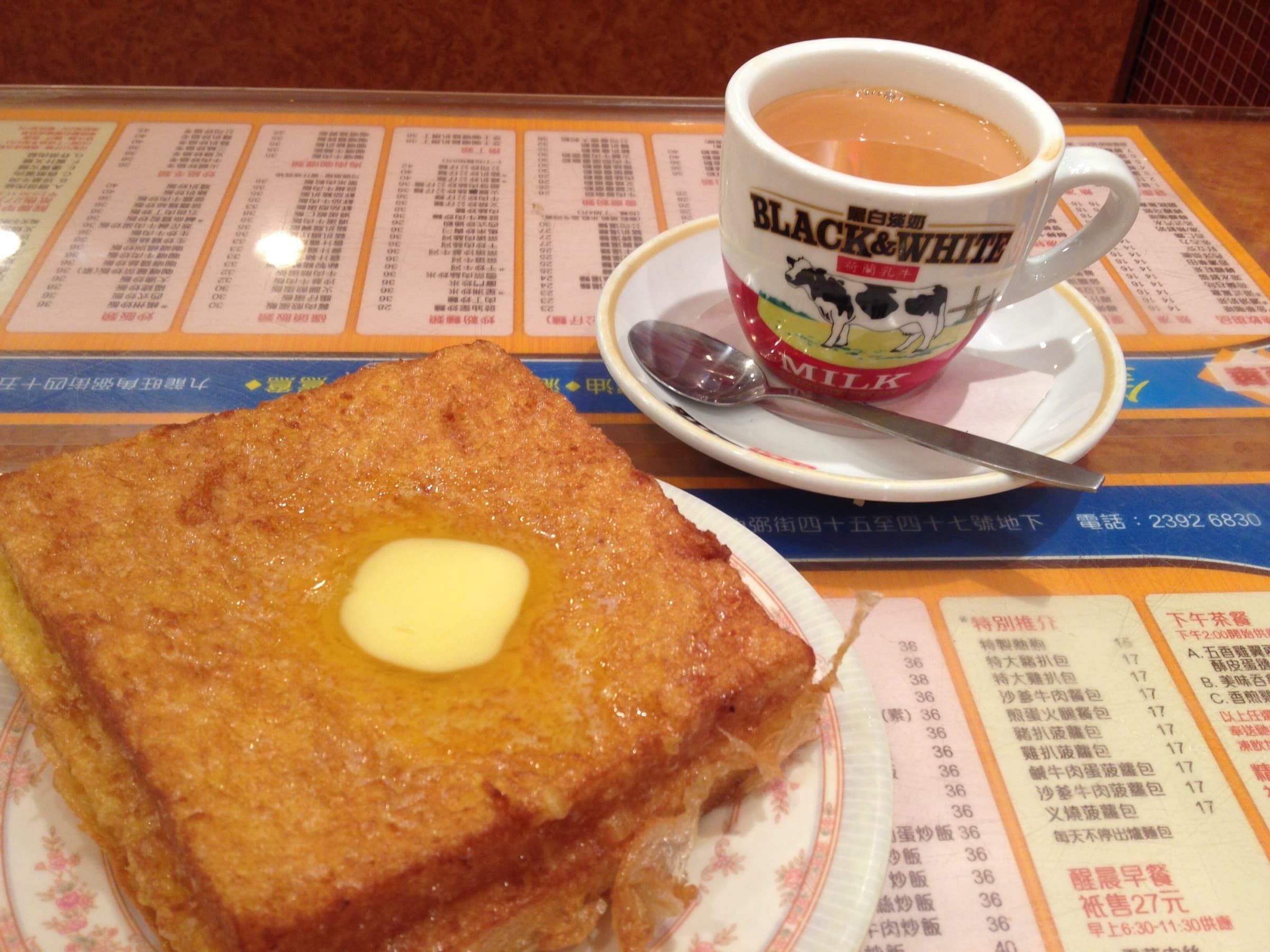 Hong Kong–style French toast with butter and a cup of milk tea