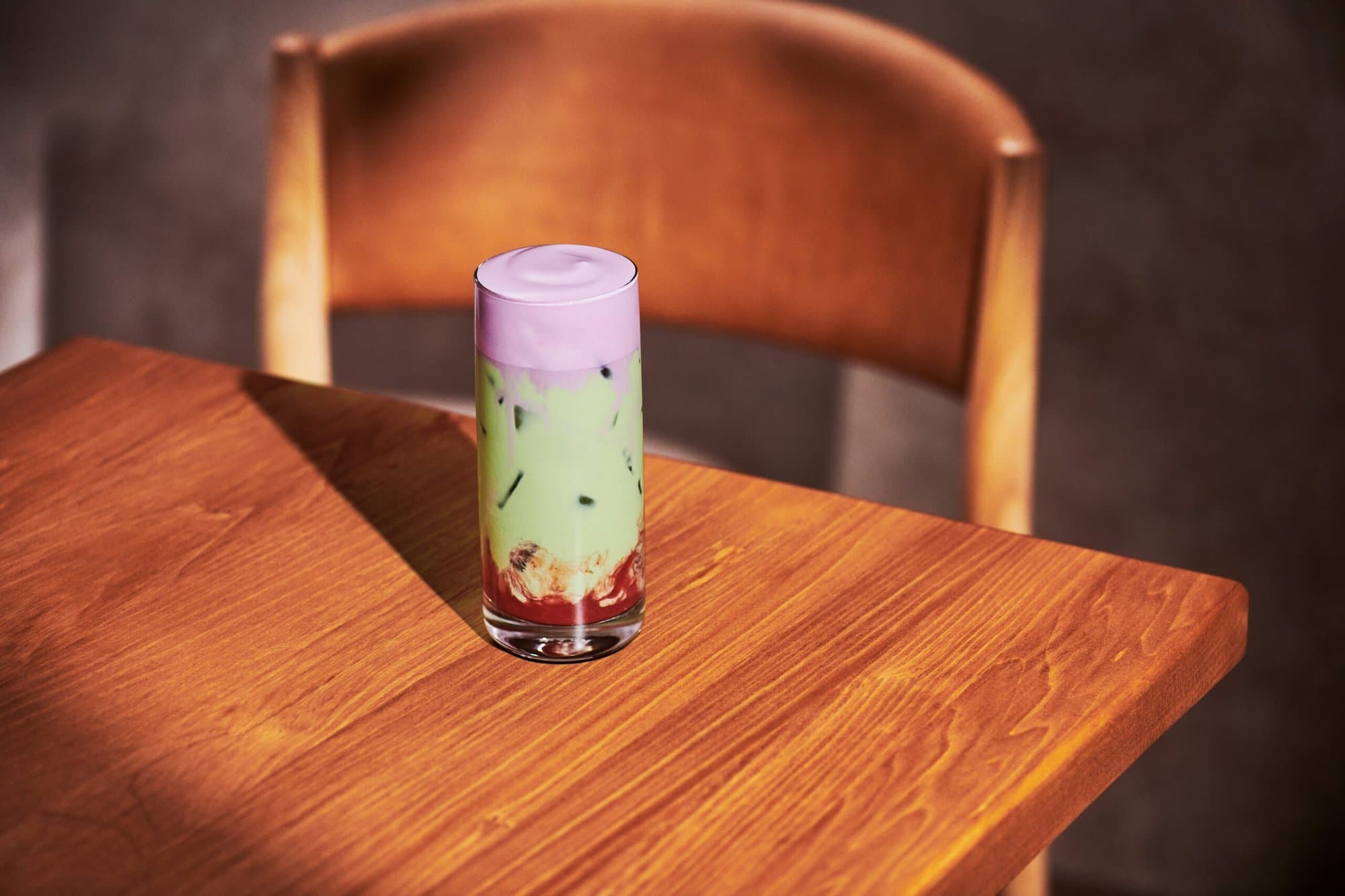 Starbucks Iced Double Berry Matcha in a tall glass with berry cold foam and strawberry puree