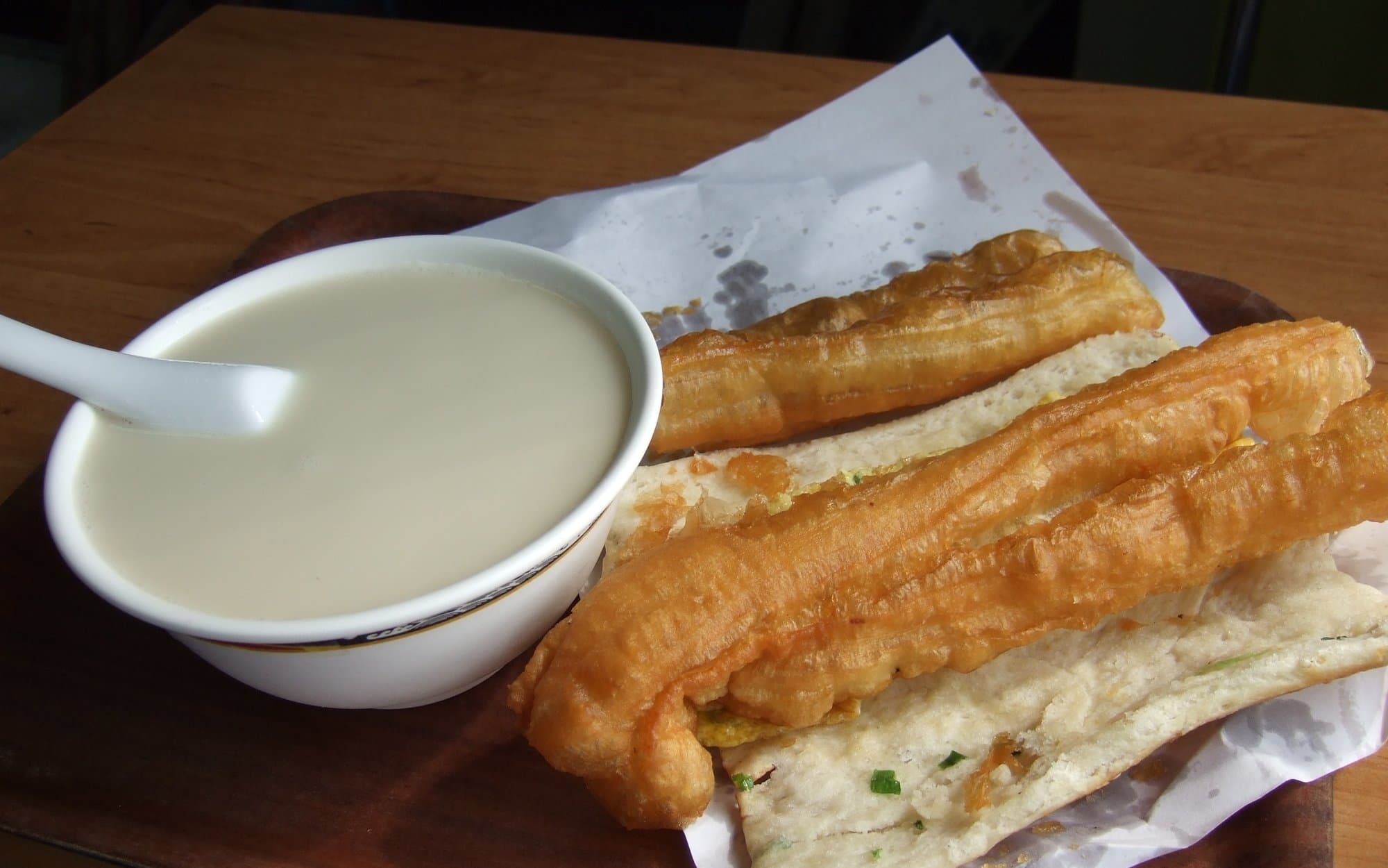 Taiwanese breakfast tray with soy milk, youtiao, and flatbread